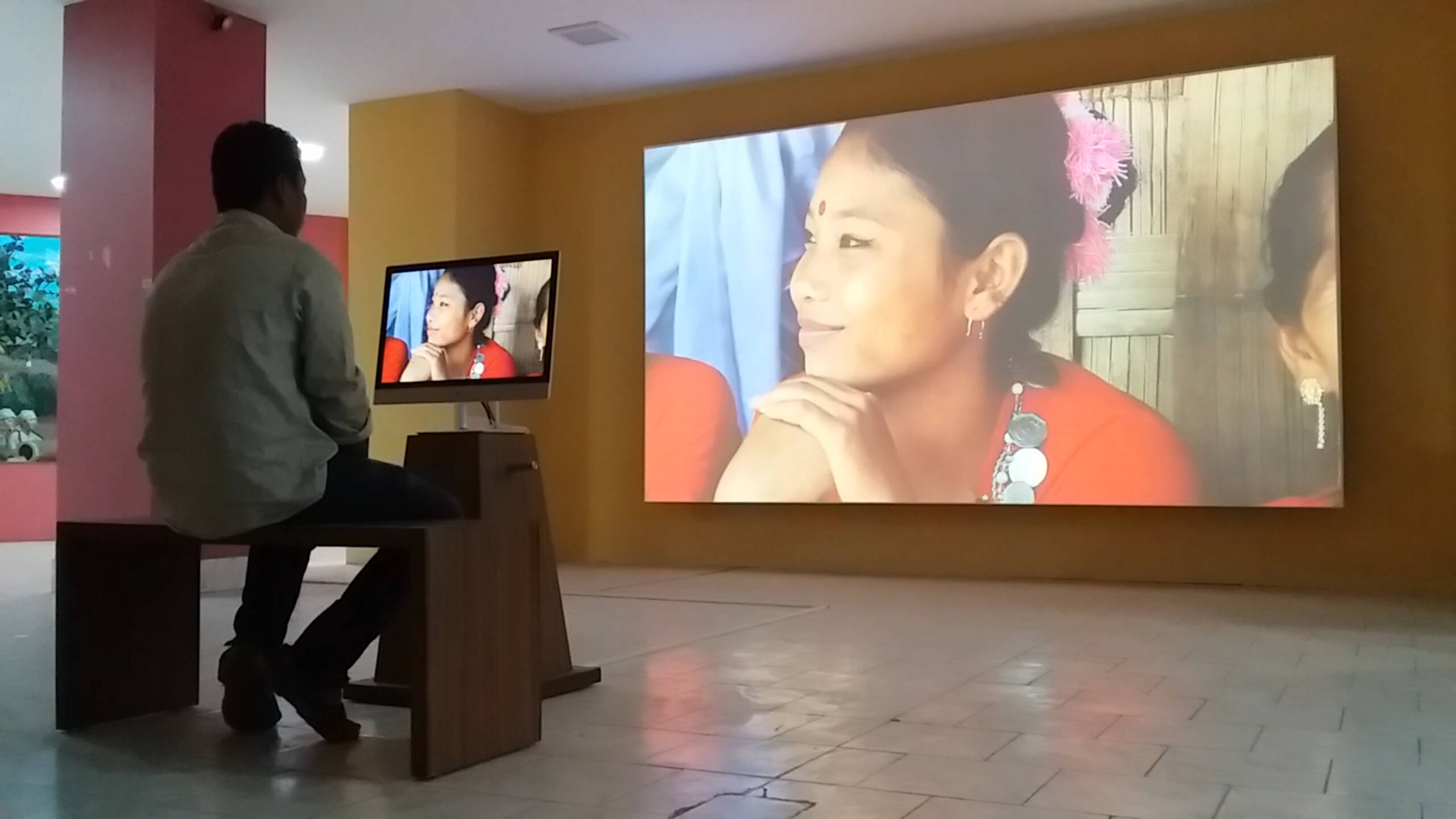 Visitor enjoying the Media Wall at Tripura State Tribal Museum