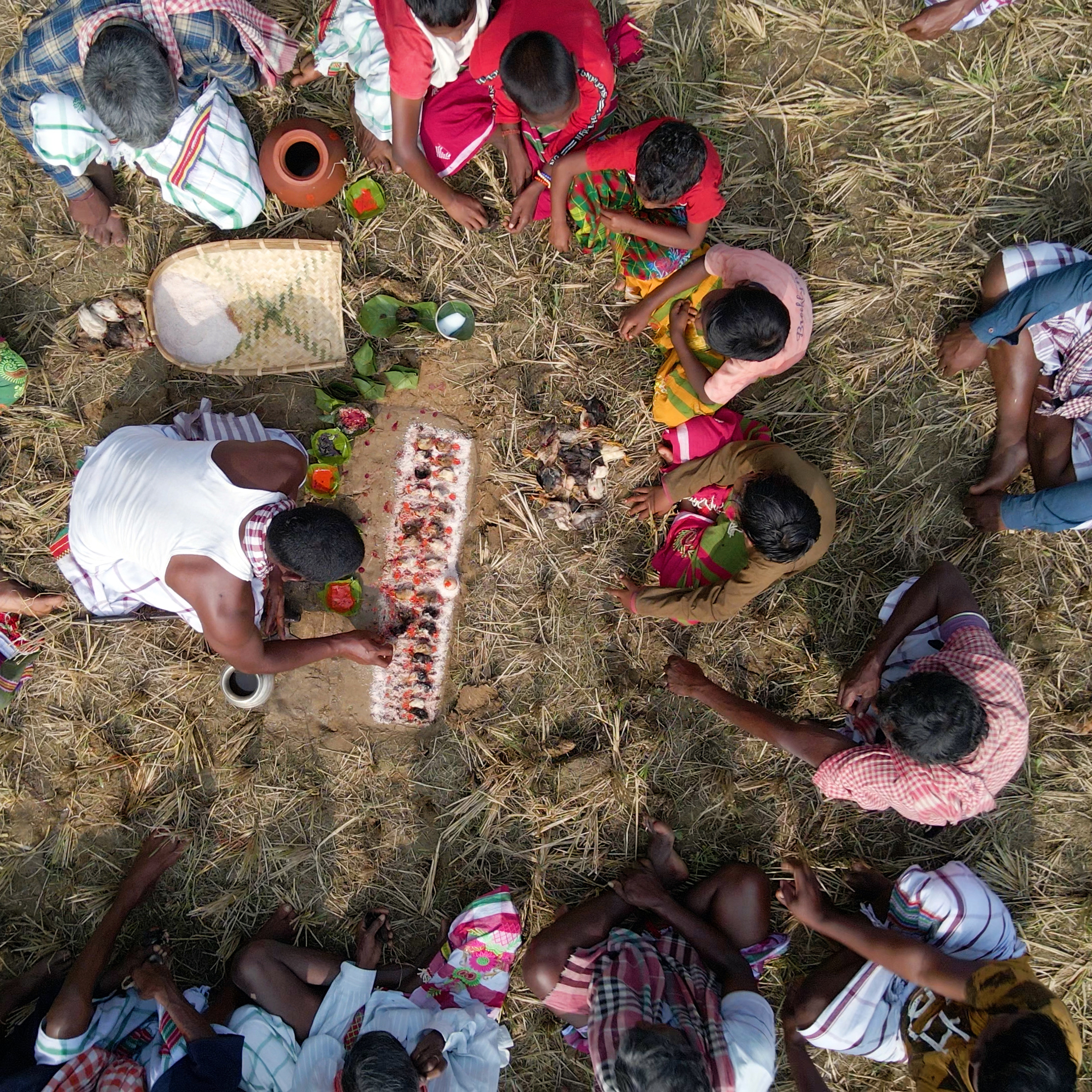 Priest conducting rituals on the occasion of Santal festival Sohrai