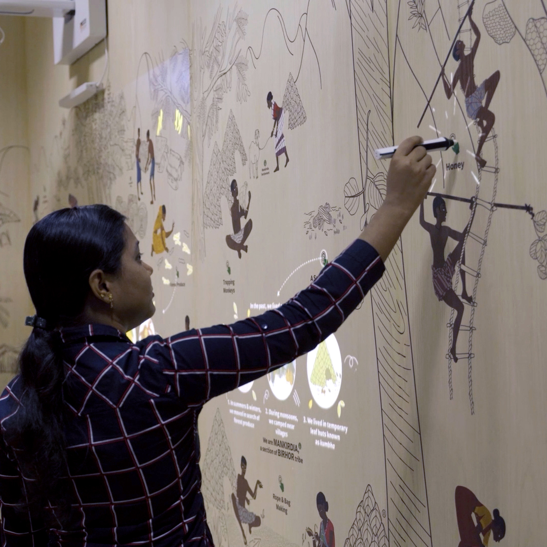 Girl interacting with 'Take Me to the Forest', an Interactive Media Wall