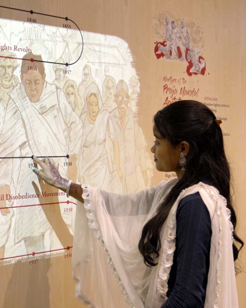 A girl touching Interactive Media Wall